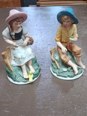 Porcelain figurines: farmer child holding carrrots, farmer girl w/ apples pair
